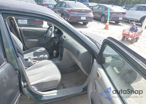 2001 Toyota Corolla Ce z USA, uszkodzony, nr VIN 2T1BR12E81C462570